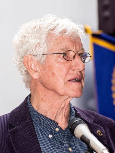 Man speaking into microphone