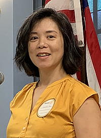 Woman at the podium.