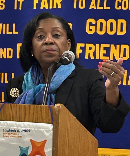 Woman at the podium.