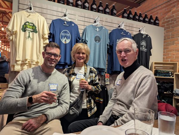 Three people enjoying the Rotary Happy Hour.