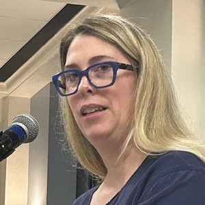 woman speaking into microphone