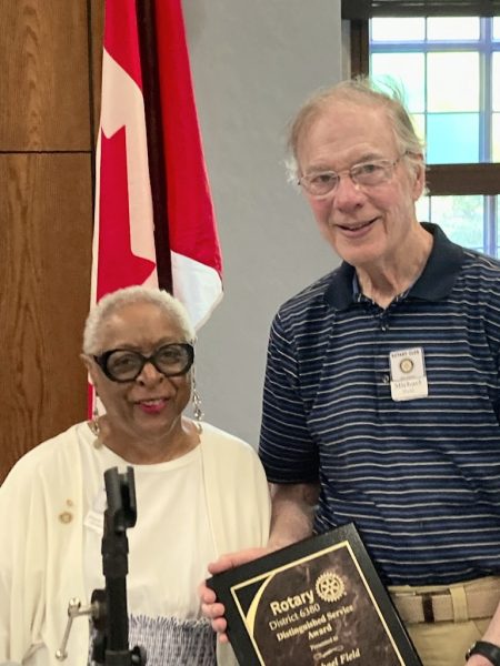 Short woman with taller man posing for the camera.