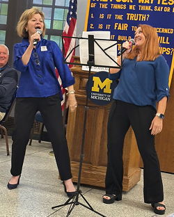 Two women singing.