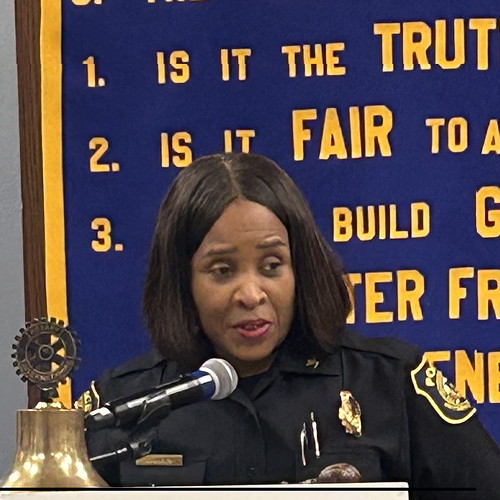 Woman at podium.