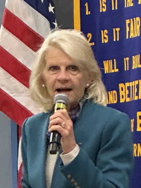 Woman holding microphone.