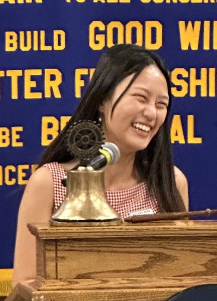 Young woman at podium.