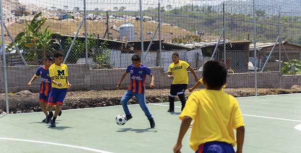 Kids playing soccer.