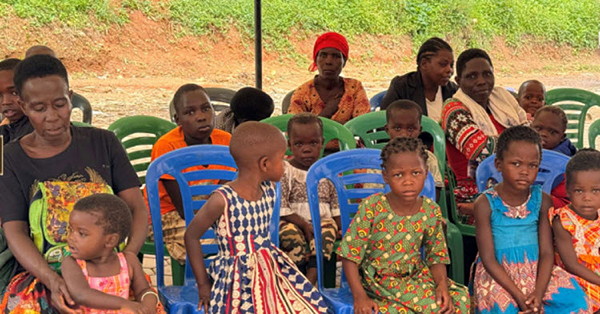 Families sitting in chairs.