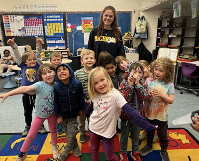 Teacher with young students.