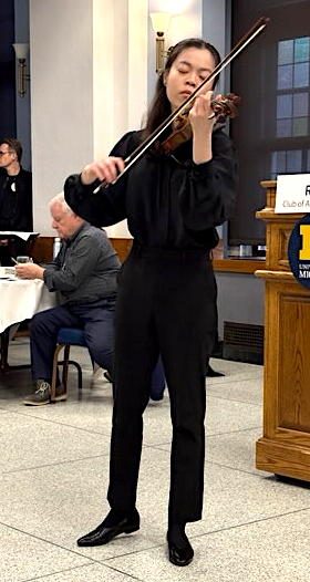 Young woman playing the violin.
