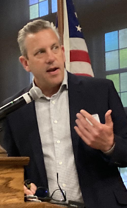 Man speaking into microphone.