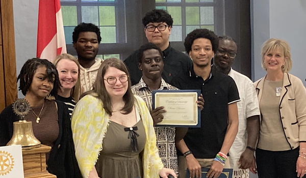 Group of high school students with Rotary Club mentors.